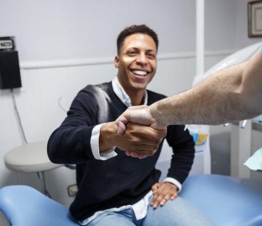 Man shaking hands with his dentist