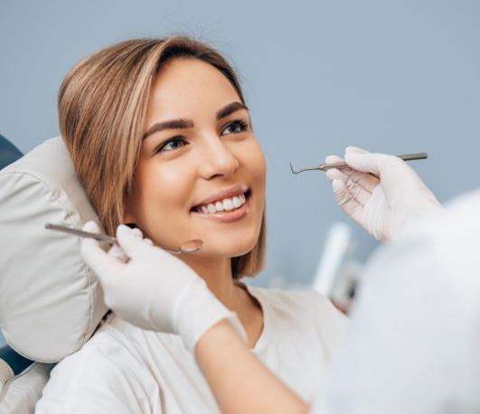 Woman smiling during a dental checkup