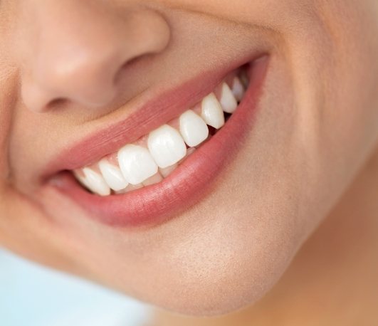 Close up of smiling woman with white teeth