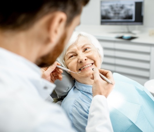 Senior woman smiling at dental exam