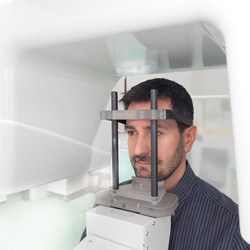 dental patient standing in dental cone beam CT in Waco