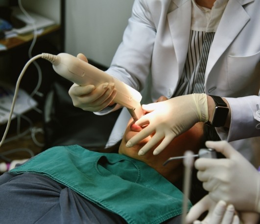 Man getting digital dental impressions of his teeth taken