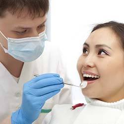 Waco emergency dentist performing a dental exam on a patient