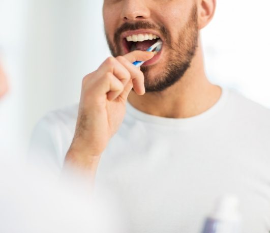 Man brushing his teeth