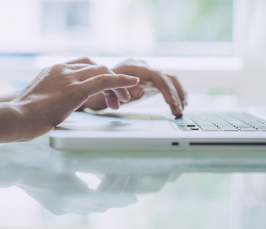 Person typing on laptop