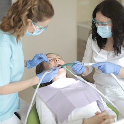 Woman at Humana dentist in Waco.