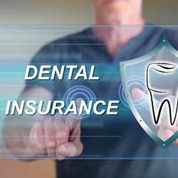Man pointing to dental insurance on a screen.