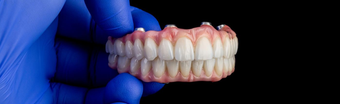 Older woman with implant-retained dentures in Waco.