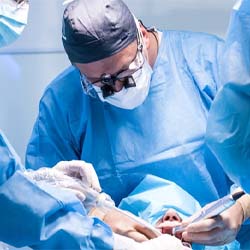 dentists performing dental implant surgery on a patient