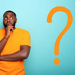 Man with orange question mark wonders about dental implants in Waco