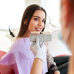 veneer chart in front of woman