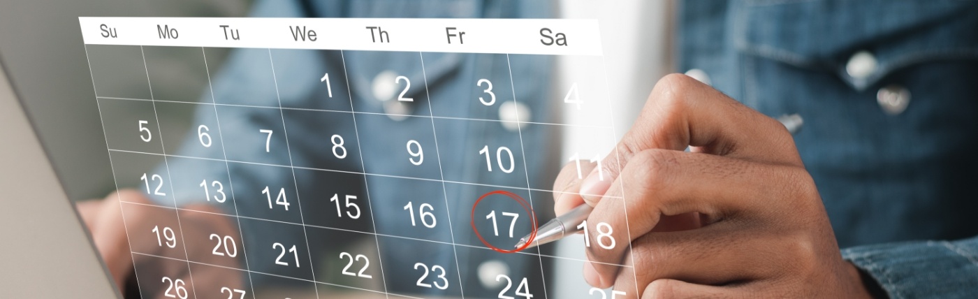 Person circling date on calendar for dental appointment in Waco