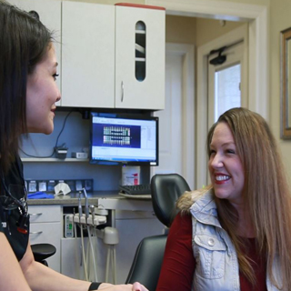 patient smiling with dentist