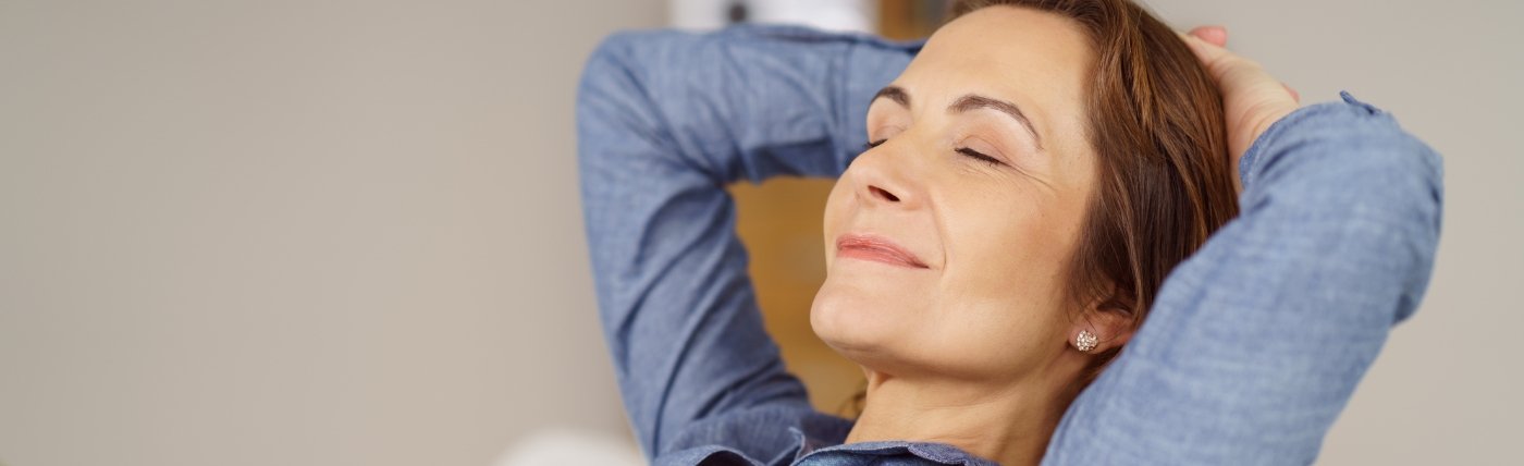 Dental patient relaxing with her eyes closed thanks to sedation dentistry in Waco