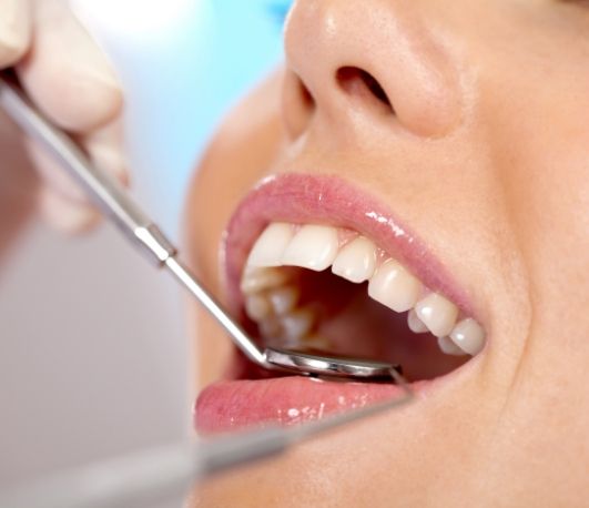 Close up of a person receiving a dental exam
