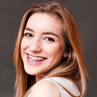 young woman smiling with braces