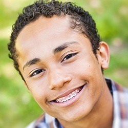 young boy with pink braces