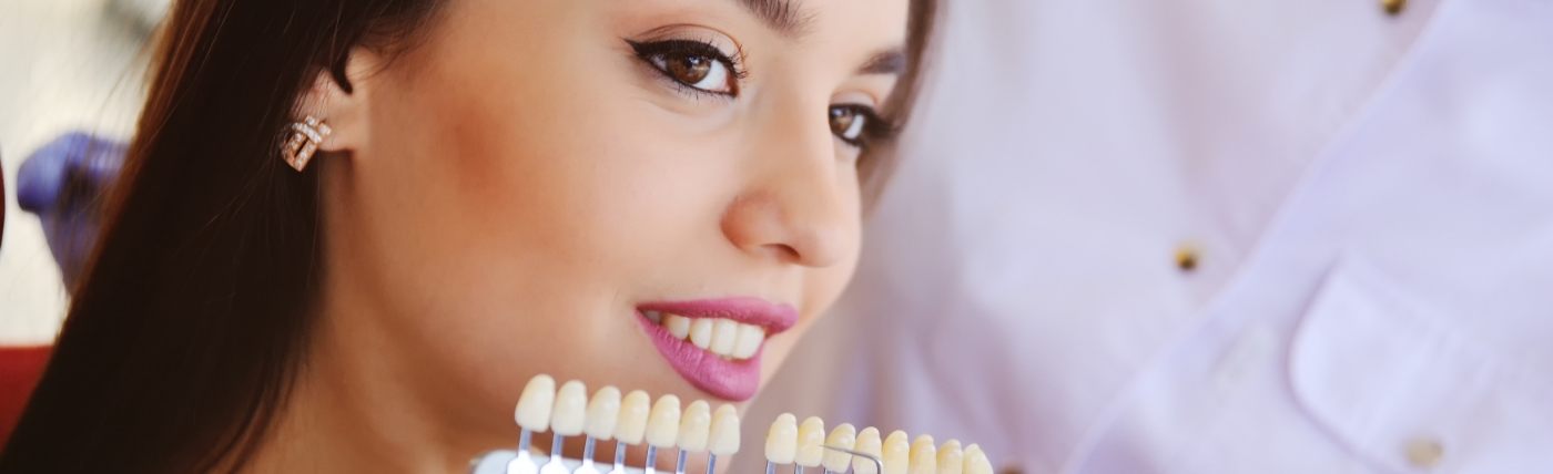 Woman being fitted for veneers by Waco cosmetic dentist