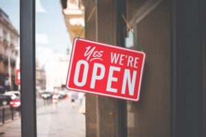 Your Waco dentist displays a "yes we're open" sign