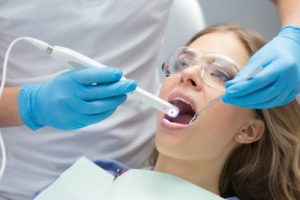 Dentist using technology to detect dental cavities in Waco