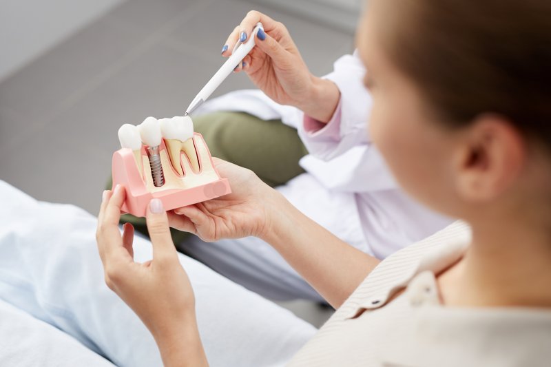 dentist explaining dental implants to patient