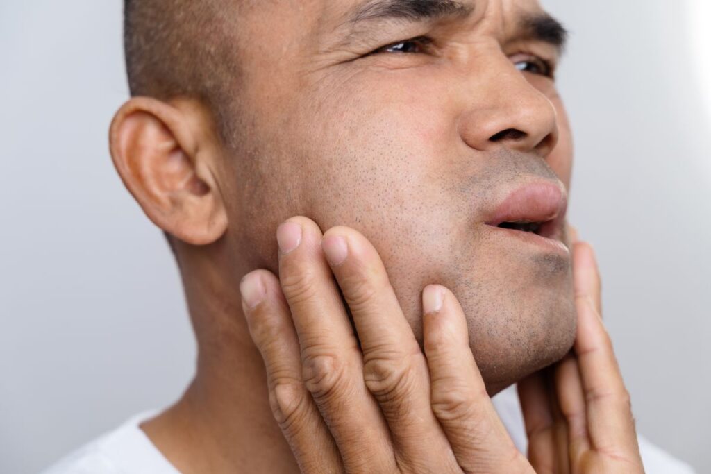 A man with a swollen cheek